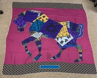 Lot	208	Hermes Cheval Sur Mon Carre Cashmere Wrap	Hermes multi color A Cheval Sur Mon Carre scarf/shawl/wrap. CSMC is Hermes's iconic silk design, Made in France. Tag reads 65% cashmere and 35% silk. Dry clean only. 53" x 52"
