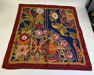Lot	210	Salvatore Ferragamo Silk Scarf	Salvatore Ferragamo silk floral printed scarf with signature. Good condition. 34" l x 33" w

