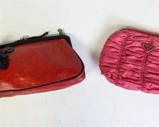 Lot	218	2 Small Prada Handbags Red Black Flowers and Pink	Lot includes two small Prada clutches. Red leather with black flower applique with leather and chain shoulder strap, with dust bag ,10" L x 5" h x 2" D, has a tape mark residue inside bag; Pink nylon clutch with zipper closure, pen mark on one side, 9" L x 6 " h x 2" D
