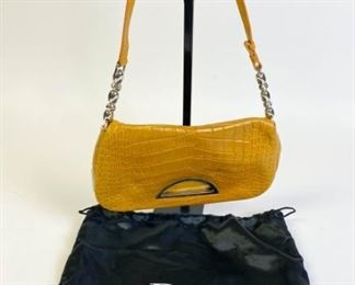 Lot	231	Diane Von Furstenberg and Rose Iris Lane Clutches	Two small purses; yellow Diane Von Furstenberg framed hard-shell Tonda clutch with detachable chain, enamel bar hinge clasp, 8.25" l x 4" w x 2.5" d - Strap Drop 20" marks and wear inside, outside condition good; Rhinestone rose embellished Iris Lane framed hard shell clutch with detachable silver tone chain, missing top gem, 8" l x 3.25" w x 2" d - Strap Drop 24", some staining and marks on interior
