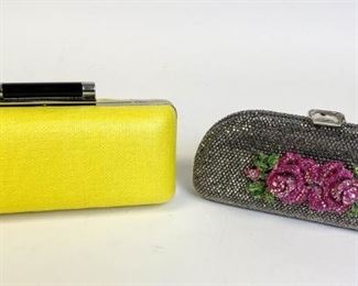 Lot	232	Ermanno Scervino White Ostrich Purse	White Leather Ostrich purse with rhinestone handle by Ermanno Scervino. Removable leather strap. Some yellowing on edges and a tape mark on the inside, 17"l x 12" h x 7" w
