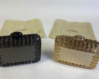 Lot	238	Roberto Cavalli Black Silver Studded Purse	Roberto Cavalli Regina Radiant studded satchel bag in black lambskin leather with inlaid chain and leather handles, magnetic closure, internal zip and slip pockets, microfiber lining and silver tone hardware detail. Made in Italy. Marks and stains on lining. 16" l x 9" w x 7" d 17" l x 12" w x 8" d
