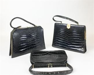 Lot	242	3 French Alligator Handbags	Some wear. Largest 12"L x 10"H
