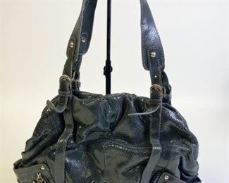 Lot	244	HYPE Green Snakeskin Shimmer Leather Satchel	Green snakeskin bag with double handle, satin giraffe print lining, multiple inside pockets with one zippered pocket, two outside pockets with silver tone rivets, magnetic closure, some wear of leather on lower corner, gently used condition, measures 12"W at base
