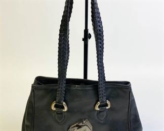 Lot	246	Barry Kieselstein-Cord Black Leather Purse	Barry Kieselstein-Cord leather bag in black with silver tone horse emblem on side, woven double leather handles, metal tag marked Barry Kieselstein-Cord, lined inside with green suede, some staining, one small zippered pocket with pull embossed with “Kieselstein-Cord/1995/925” and moon/star logo, snap closure, each foot on the bottom is embossed with “Kieselstein-Cord/1995/925”, some wear on bottom, measures 12"W x 10"D
