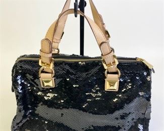 Lot	245	Michael Kors Grayson Sequined Bag	Michael Kors Top Handle Bag, black sequins & gold-tone hardware, leather Trim, flat handles, single adjustable shoulder strap; logo jacquard lining, five interior pockets, zip closure at top, protective feet on bottom, measures 14"W x 9"H x 9"D
