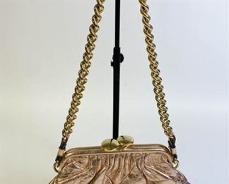 Lot	249	Marc Jacobs Copper Metallic Stam Bag	Marc Jacobscopper metallic patchwork leather bag with gold tone chain, frame opening secured by a kiss-lock, lined with grey linen fabric, made in Italy, authentication card included, good condition, 12"L x 8"D
