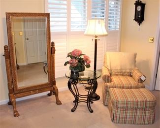 Cheval mirror, glass top table, club chair with ottoman and floor lamp.  