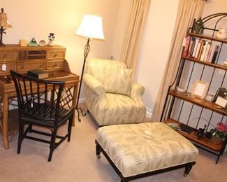 The family room is full of quality, clean furniture.  The fern motif chair and ottoman would be a lovely addition to any home.  