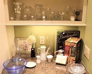 The kitchen is full of glassware, china and lots of clean items.  