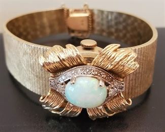 Gold and opal Geneva watch or use as a bracelet.