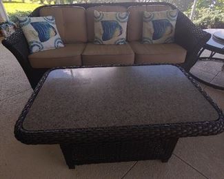Patio Couch & Coffee Table. (There is an additional Top for the coffee table-same- color) Vinyl Wicker, Brown with taupe cushions