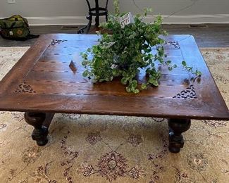 Lot 5504. $200.00. Massive Hardwood Coffee Table, with Turned Legs, Carving at the corners, plenty of style, intentionally distressed. Fits in with a farmhouse style. 43"w x 55"l x20"h. Heavy. Great table for a home with kids. Other items in this picture are available in upcoming lots.