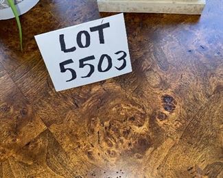 Lot 5503. $175.00. Cute Round Lamp Table with Burlwood parquetry top, Metal legs on a triangular base. Tabletop is 28" in diameter, height 29". (Lamp and plant are grouped in Lot 5508)