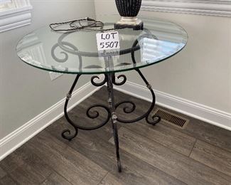 Lot 5507 $175.00 Beveled Glass Top Side/Foyer Table with Wrought Iron Base. 36"round x 31"h Lamp is available in a later lot.