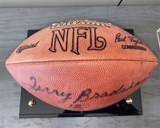 Lot 5514. $225.00. Terry Bradshaw Signed Football, in Sharp Acrylic Footed Case, measures 12.5" long, 8" wide x 9.5" tall. No COA, but nice clear signature, Perfect for your Man Cave!