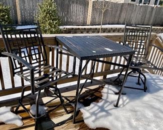 Lot 5516. $85.00. Outdoor Bistro Table and Two Swivel Chairs. The tabletop needs to be scraped and spray painted, the two chairs are in good shape, they come with two turquoise chair pads. Bistro table height.