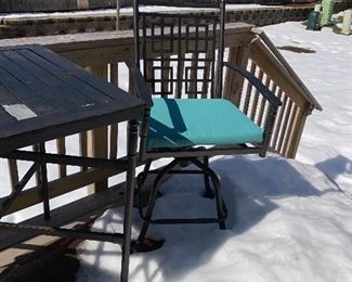 Lot 5516. $85.00. Outdoor Bistro Table and Two Swivel Chairs. The tabletop needs to be scraped and spray painted, the two chairs are in good shape, they come with two turquoise chair pads. Bistro table height.