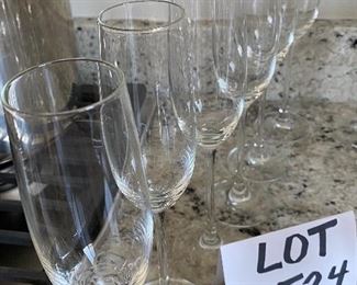 Lot 5524. $18.00. 6 sleek champagne flutes (1 has a chip on the base).