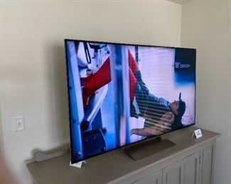 Lot 5581. Was $995.00 Today is $600.00 Firm. Sony 65" Android TV & Alexa, XBR-65X930E, w/ remote. Model yr. 2017. 4K (3840 x 2160 Resolution); Inputs: 4 – HDMI, 2 - USB2.0, 1 – USB3.0, 1 – Component/Composite Hybrid, 1 – Composite, Voice Remote Control (RMF-TX200U), WiFi/Bluetooth, Works with Alexa, ChromeCast built-in Smart TV. Measures 57" W x 36" H x 12" D Base. Orig Retail Cost $2,900.00