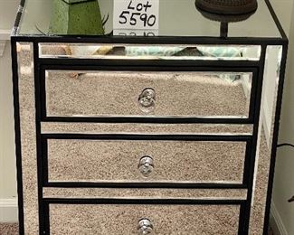 Lot 5590. $235.00. Matched pair of mirrored 3 drawer side chests. Chrome hardware includes an artificial plant as shown on top.