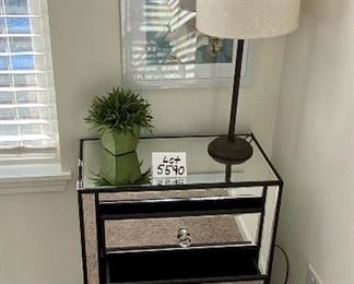 Lot 5590. $235.00. Matched pair of mirrored 3 drawer side chests. Chrome hardware includes an artificial plant as shown on top (lamp available next).