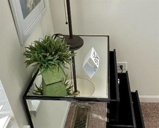 Lot 5590. $235.00. Matched pair of mirrored 3 drawer side chests. Chrome hardware includes an artificial plant as shown on top (lamp available next).