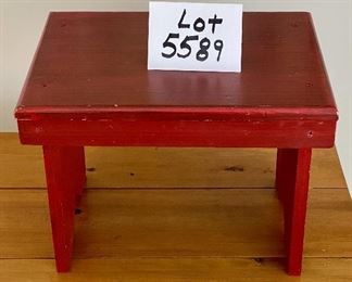 Lot 5589. $20.00. Red painted footstool with black metal handles.