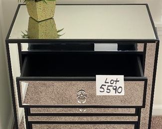 Lot 5590. $235.00. Matched pair of mirrored 3 drawer side chests. Chrome hardware includes an artificial plant as shown on top.