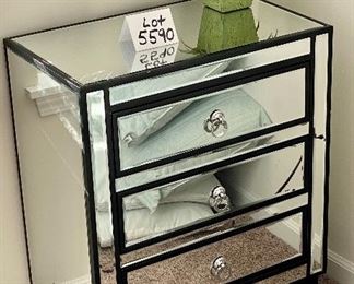 Lot 5590. $235.00. Matched pair of mirrored 3 drawer side chests. Chrome hardware includes an artificial plant as shown on top.