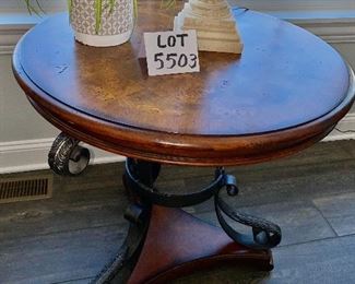 Lot 5503. $175.00. Cute Round Lamp Table with Burlwood parquetry top, Metal legs on a triangular base. Tabletop is 28" in diameter, height 29". (Lamp and plant are grouped in Lot 5508)