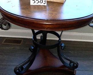 Lot 5503. $175.00. Cute Round Lamp Table with Burlwood parquetry top, Metal legs on a triangular base. Tabletop is 28" in diameter, height 29". (Lamp and plant are grouped in Lot 5508)
