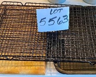 Lot 5563. $24.00. 2 well-used Cookie Sheets, 3 Cooking Racks & Wooden Cutting Board.