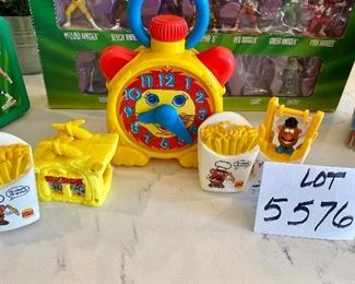 Lot 5576. $18.00. Playskool Stop N Go Wind-up Clock (works!), McDonald's Flintstones Meal Toy, "Roc Donald's Building Accessory c.1993, 2 Burger King French Fry Squirters, Burger King French Fry Jumper.