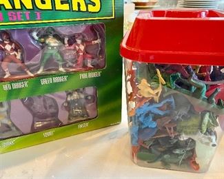 Lot 5575 $45.00. Container of mixed animals, dinosaurs, Indians and cowboys, Power Rangers Storage Box, and Power Rangers Collector Set One. May be missing a ranger or two.