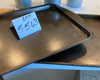 Lot 5563. $24.00. 2 well-used Cookie Sheets, 3 Cooking Racks & Wooden Cutting Board.