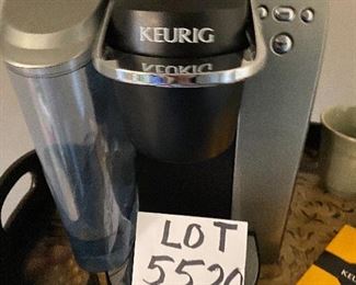 Lot 5520. $65.00. Keurig Machine, a glass canister (perfect for storing K-Cups or beans), and 4 Pottery Barn Mugs.
