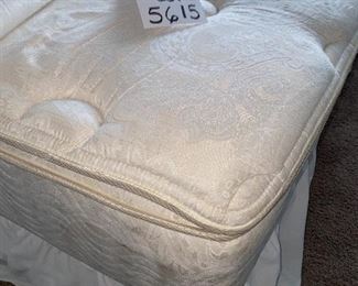 Lot 5615. $425.00. Queen Bed, With Nailhead and Fabric Headboard, Ralph Lauren premier mattress pad, comforter (Duvet?), 4 pillows and shams (2 are Euro) pillowtop mattress by Beauty Rest Wilshire Plus comfortable.