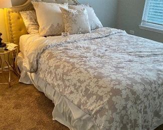 Lot 5615. $425.00. Queen Bed, With Nailhead and Fabric Headboard, Ralph Lauren premier mattress pad, comforter (Duvet?), 4 pillows and shams (2 are Euro) pillowtop mattress by Beauty Rest Wilshire Plus comfortable.