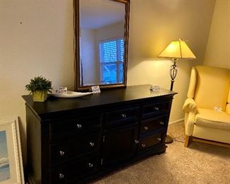 Lot 5603. $1,625.00 King Bedroom Set Includes Pennsylvania House Steve Tyrell Collection King 2 poster Headboard, (see index card following for story) Footboard and Frame, 73" tall, a tall Black chest dresser 38"w x 19" d, x53" tall 6 drawers; not branded, and 7 drawer dresser with cabinet with 2 drawers, 66" x 19" d x 33.5" unbranded as well, also in Black.