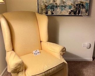 Lot 5604.$150.00 Hearthside Classics Recliner, in Yellow. Pretty recliner in a bedroom.