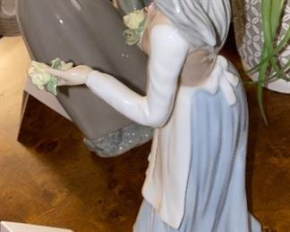 Lot 5598 $40.00. Tengra Girl Figurine holding a basket of flowers. 11"x5"w. Tengra is a similar manufacturer to Lladro - made in Spain; it's all in the clay.