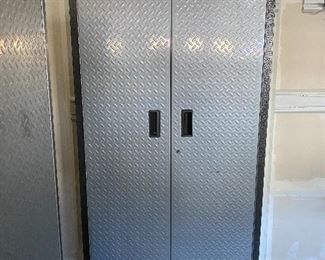 Lot 5625 $450.00 2 Gladiator by Whirlpool. Heavy Duty Steel Cabinets with Grey Hammered Doors and Granite Finish, 3 Adjustable Shelves either Floor Standing or on Wall Hanging on Gladiator Brackets. Definite upgrade for your garage...We never get to sell these because the new homeowner's usually include in contract. 36" W x 18" D x 72" H