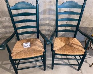 Lot 5643A. $40.00. A pair of pretty forest green ladderback chairs with Rush Seats