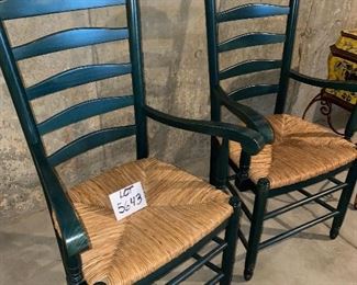 Lot 5643A. $40.00. A pair of pretty forest green ladderback chairs with Rush Seats