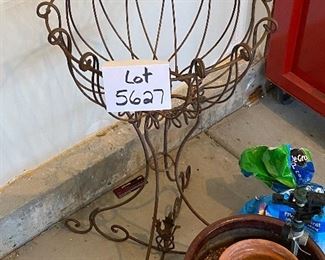 Lot 5627 $45.00 Garden Special (Spring Please Arrive Early!) includes: Wrought Iron Plant Stand; Large Brown Ceramic Pot, 2 Green Knee Pads, Nozzle and 2 Sprinklers, another terra cotta smaller pot