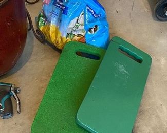 Lot 5627 $45.00 Garden Special (Spring Please Arrive Early!) includes: Wrought Iron Plant Stand; Large Brown Ceramic Pot, 2 Green Knee Pads, Nozzle and 2 Sprinklers, another terra cotta smaller pot