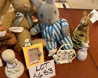 Lot 5653. $35.00. Easter Bunny Lot: Includes 3 Plush Bunnies (may be Vintage; cute), One Bunny Candle Holder, Chalkware White Bunny, 3 Easter frames, 1 Prec. Moments Boy Holding egg, 1 Bunny Porcelain Bell andf 16 Speckled Eggs. (Use for Centerpiece with Faux Grass and a Basket.