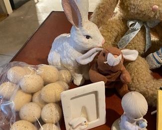 Lot 5653. $35.00. Easter Bunny Lot: Includes 3 Plush Bunnies (may be Vintage; cute), One Bunny Candle Holder, Chalkware White Bunny, 3 Easter frames, 1 Prec. Moments Boy Holding egg, 1 Bunny Porcelain Bell andf 16 Speckled Eggs. (Use for Centerpiece with Faux Grass and a Basket.
