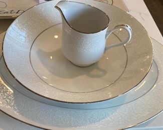 Lot 5602. $170.00. Service for at least 12 "Grace" Fine China "Concerto" pattern - Textured Rim, White with a Simple Ring of Silver on base and Rim. 43 pcs-- 14 Dinner, 12 Salad, 14 B&B, Large Oval Platter, Round Veggie Dish & Creamer. I think when they moved one box was lost, in the move so there are no cups and saucers nor a sugar bowl! Still, you can set a beautiful table with these items in time for Easter Sunday!